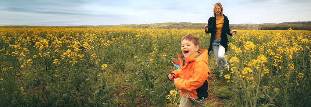 Truck parked out in nature.
